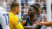 Tensions flared in the 36th minute between Arsenal's Bukayo Saka (right) and Tottenham Hotspur's Guglielmo Vicario (left).