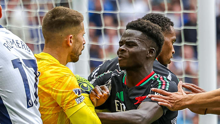 Tensions flared in the 36th minute between Arsenal's Bukayo Saka (right) and Tottenham Hotspur's Guglielmo Vicario (left).