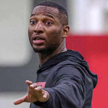 Arkansas Razorbacks secondary coach Nick Perry during preseason camp drills Tuesday at the indoor practice center in Fayetteville, Ark.