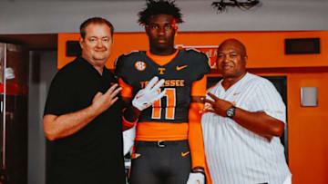 Hezekiah Harris poses for a photo with Josh Heupel and Coach Chop.