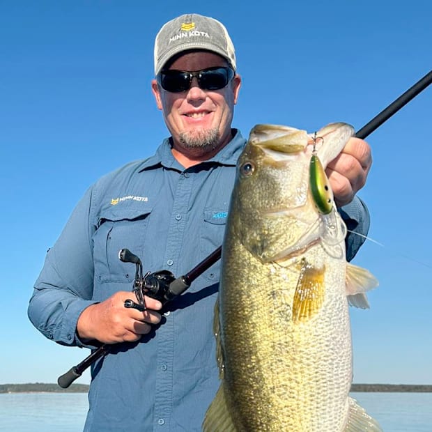 Bassmaster Elite Pro Keith Combs holding up a big Texas bass.