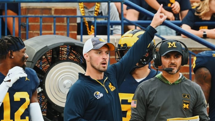 Connor Stalions signals from the sideline