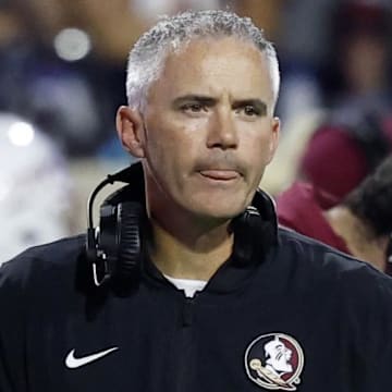 Sep 26, 2025; Charlottesville, Virginia, USA; Florida State Seminoles head coach Mike Norvell looks on during a stoppage in play against the Virginia Cavaliers at Scott Stadium. Mandatory Credit: Geoff Burke-Imagn Images