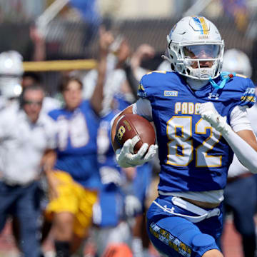 Serra wide receiver Charlie Wiley (82) is one of the few key returning starters from last year's squad. Here he scored on an 80-yard catch and run during a 21-14 opening win over Folsom to start the 2023 season. Serra beat Folsom again to start 2024 Friday, 22-21, moving up to the top spot in the SBLive CCS rankings. 