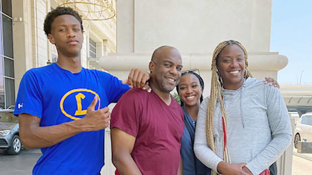 Khary Adams with his family, (from left) father Paul, sister Nyla and mother Cherita.