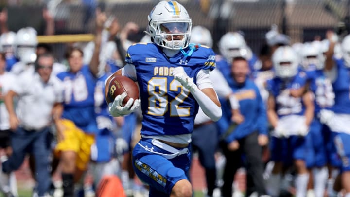 Serra wide receiver Charlie Wiley (82) is one of the few key returning starters from last year's squad. Here he scored on an 80-yard catch and run during a 21-14 opening win over Folsom to start the 2023 season. 