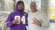Anthony Jones and former UW co-defensive coordinator William Inge share a moment on a Tennessee visit. 