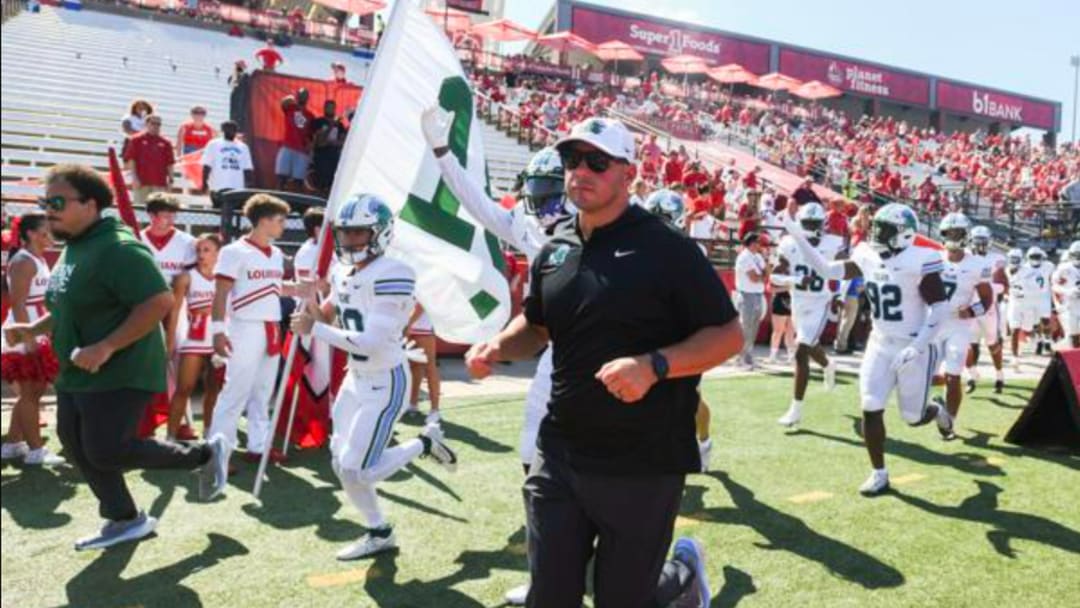 Tulane head coach Jon Sumrall leads the team into the stadium for their game against Louisiana Ragin' Cajuns at Cajun Field on Saturday, September 21st, 2024.