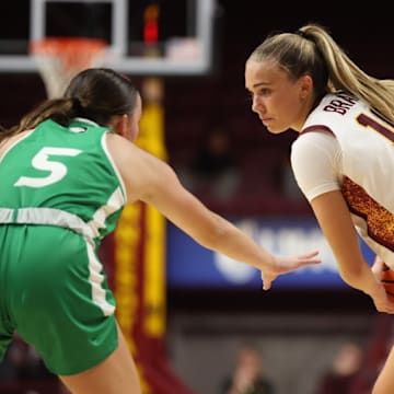Mara Braun trying to get past a North Dakota defender in Minnesota's season-opening win.