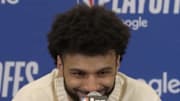 Murray flashes a grin while speaking to reporters. 