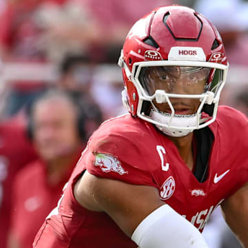 Arkansas Razorbacks quarterback Taylen Green at the mesh point with a running back against the Alabama A&M Bulldogs in the season-opening win at Razorback Stadium in Fayetteville, Ark.