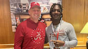 Bralan Womack poses with Alabama coach Kalen DeBoer