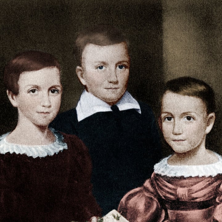 Emily Dickinson is pictured with her siblings Austin and Lavinia