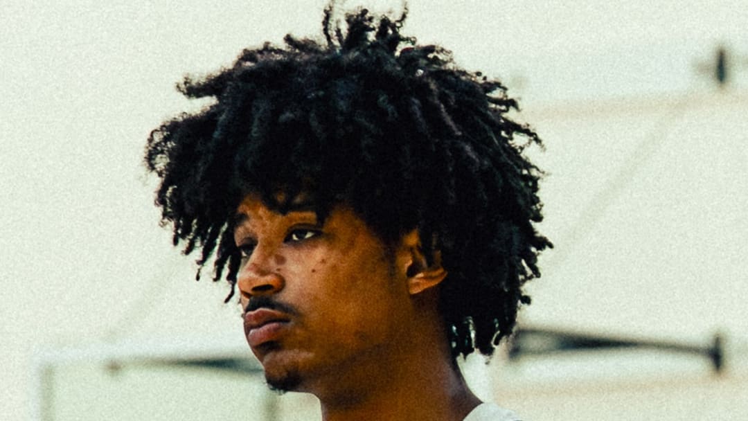 Apr 7, 2026; Portland, OR, USA; Tajh Ariza (right) stands on the sidelines at practice for World Select Team before 2026 Nike Hoop Summit 