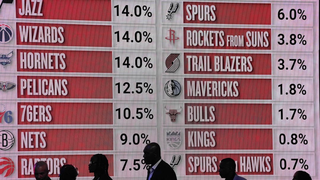 May 12, 2025; Chicago, Illinois, US; Representitives of the NBA teams walk onto the stage during the 2025 NBA Draft Lottery at McCormick Place. Mandatory Credit: David Banks-Imagn Images