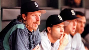 Seattle Mariners pitcher Randy Johnson (L) looks o