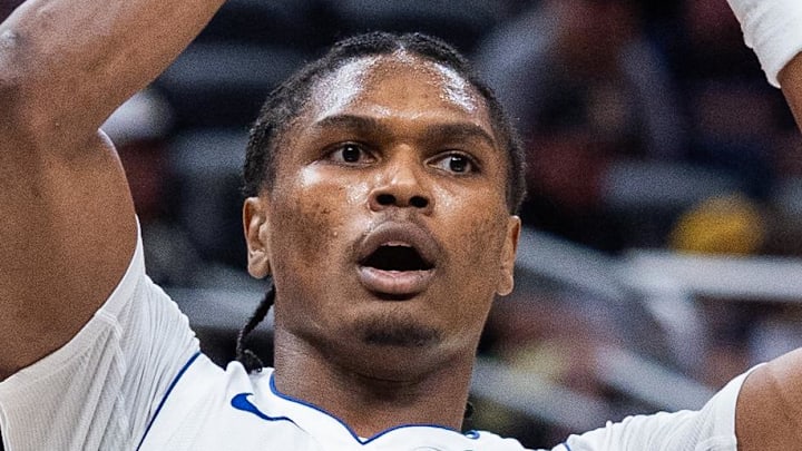 etroit Pistons guard Ausar Thompson (9) passes the ball while Indiana Pacers guard Quenton Jackson (29) defends in the second half at Gainbridge Fieldhouse on Apr 12, 2026.