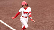 Nebraska's Samantha Bland poses as she approaches home plate after hitting one of her three home runs against Iowa on April 5, 2025.