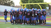 Gardena Serra huddles before taking on Orange Lutheran at home on Aug. 23, 2024.