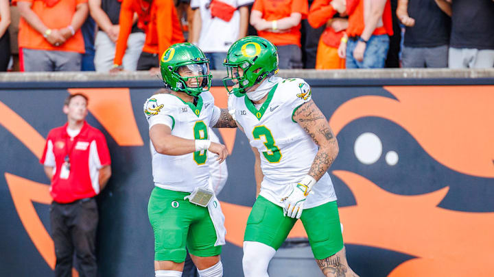 Oregon Ducks quarterback Dillon Gabriel and tight end terrance ferguson celebrate in the win over the Oregon State Beavers