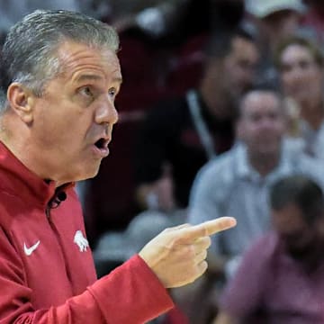 Arkansas Razorbacks coach John Calipari directing DJ Wagner in the exhibition opener against the Kansas Jayhawks at Bud Walton Arena in Fayetteville, Ark.