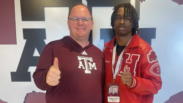 Hitchcock High School receiver Kelshaun Johnson poses with Texas A&M Aggies coach Mike Elko during a recruitment visit.