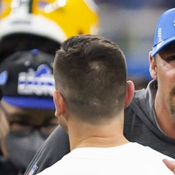 Detroit Lions head coach Dan Campbell hugs Green Bay Packers head coach Matt LaFleur.