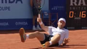 Quentin Halys prepares to hit a shot after falling down during his quarterfinal match against Gustavo Heide at Roy Emerson Arena at the Swiss Open in Gstaad, Switzerland on Friday. 