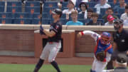 Minnesota Twins' Max Kepler is hit in the back of the helmet by New York Mets catcher Francisco Alvarez.