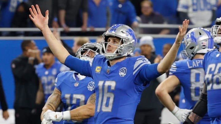 Detroit Lions quarterback Jared Goff (16) raises his arms as the Lions beat the L.A. Rams, 24-23 in the wild-card round of the NFC playoffs at Ford Field in Detroit on Sunday, January 14, 2023.