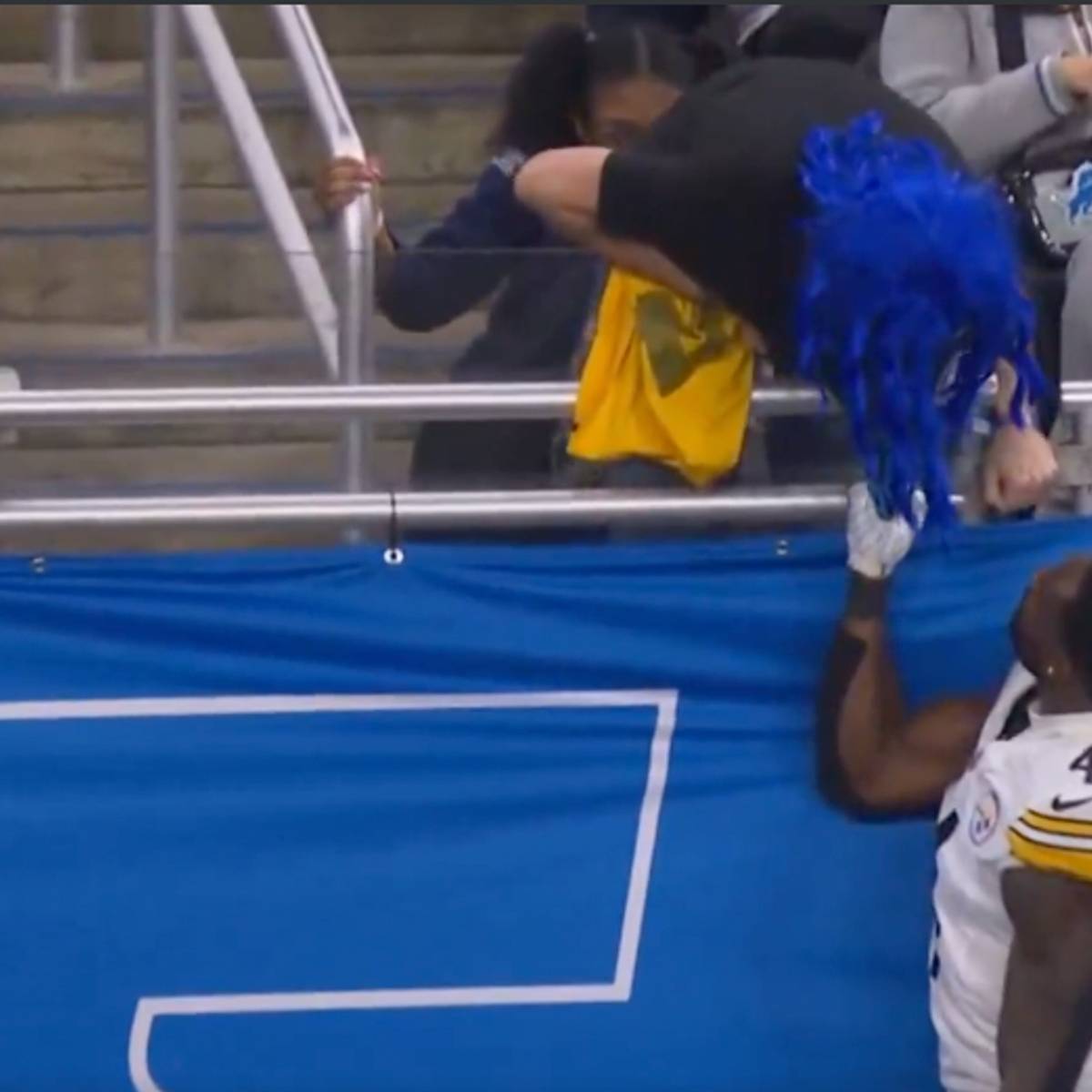 DK Metcalf Seen Taking Swipe At Lions Fan In Ugly Sideline Moment