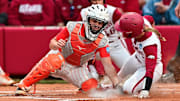 Arkansas Razorbacks Raigan Kramer slides into home in an NCAA Regional against the Oklahoma State Cowgirls at Bogle Park in Fayetteville, Ark.
