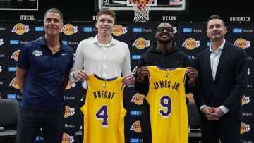 Jul 2, 2024; El Segundo, CA, USA; From left: Los Angeles Lakers general manager Rob Pelinka, first round draft pick Dalton Knecht (4), second round draft pick Bronny James (9) and coach JJ Redick pose Kat a press conference at the UCLA Health Training Center. Mandatory Credit: Kirby Lee-USA TODAY Sports