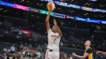 Jul 2, 2024; Los Angeles, California, USA; Washington Mystics guard Ariel Atkins (7) shoots the ball against LA Sparks forward Dearica Hamby (5) in the second half at Crypto.com Arena. Mandatory Credit: Kirby Lee-Imagn Images