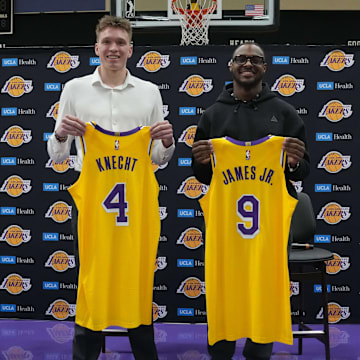 Los Angeles Lakers first round draft pick Dalton Knecht (4) and second round draft pick Bronny James (9) pose at a press conference at the UCLA Health Training Center. 