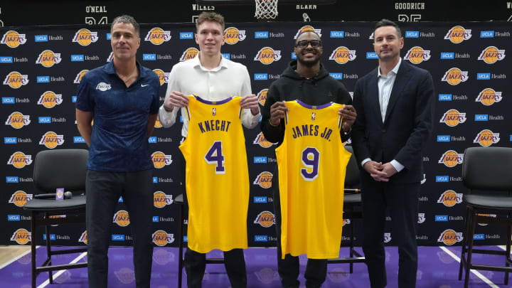 Jul 2, 2024; El Segundo, CA, USA; From left: Los Angeles Lakers general manager Rob Pelinka, first round draft pick Dalton Knecht (4), second round draft pick Bronny James (9) and coach JJ Redick pose Kat a press conference at the UCLA Health Training Center. Mandatory Credit: Kirby Lee-USA TODAY Sports