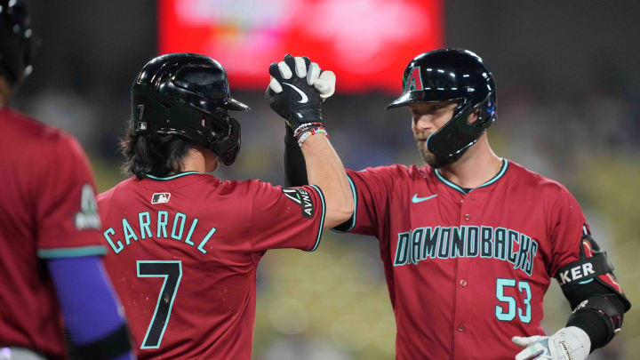 Jul 3, 2024; Los Angeles, California, USA; Arizona Diamondbacks first baseman Christian Walker (53) celebrates with center fielder Corbin Carroll (7) after hitting a three-run home run in the ninth inning against the Los Angeles Dodgers at Dodger Stadium. Mandatory Credit: Kirby Lee-USA TODAY Sports