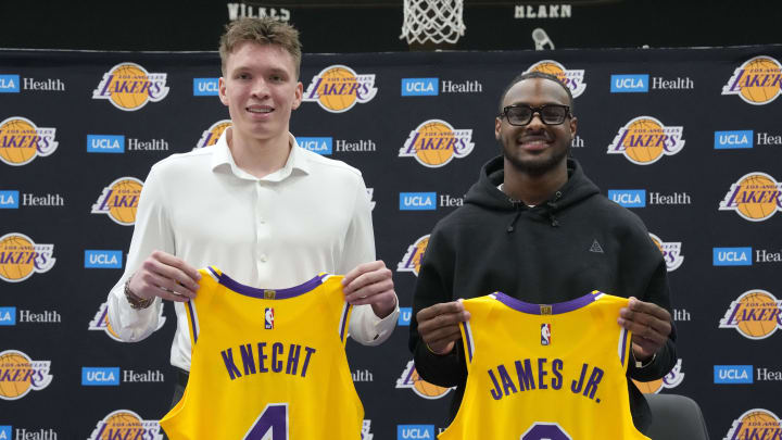 Jul 2, 2024; El Segundo, CA, USA; From left: Los Angeles Lakers first round draft pick Dalton Knecht (4) and second round draft pick Bronny James (9) pose at a press conference at the UCLA Health Training Center. Mandatory Credit: Kirby Lee-USA TODAY Sports