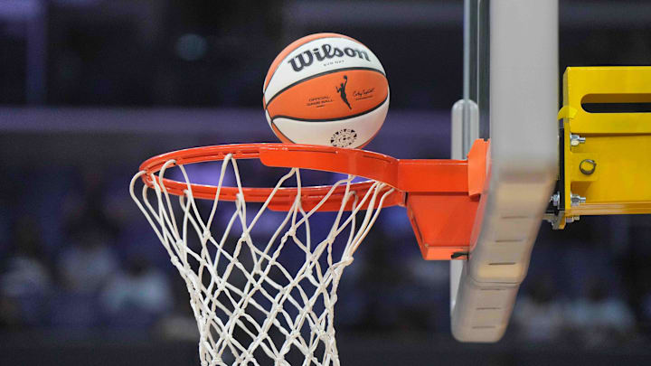 Jul 5, 2024; Los Angeles, California, USA; A WIlson official WNBA Evo NXT basketball approaches the rim and the net at Crypto.com Arena. Mandatory Credit: Kirby Lee-Imagn Images