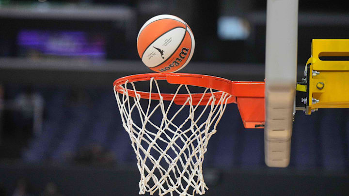 Jul 7, 2024; Los Angeles, California, USA; A Wilson official WNBA Evo NXT basketball approaches the net and rim at the Crypto.com Arena. Mandatory Credit: Kirby Lee-Imagn Images