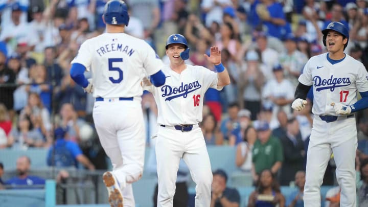 Jul 3, 2024; Los Angeles, California, USA; Los Angeles Dodgers first baseman Freddie Freeman (5) celebrates with catcher Will Smith (16) and designated hitter Shohei Ohtani (17) after hitting a three-run home run in the first inning against the Arizona Diamondbacks at Dodger Stadium. Mandatory Credit: Kirby Lee-USA TODAY Sports