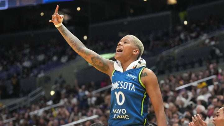 Minnesota Lynx guard Courtney Williams (10) celebrates.