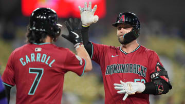 Jul 3, 2024; Los Angeles, California, USA; Arizona Diamondbacks first baseman Christian Walker (53) celebrates with center fielder Corbin Carroll (7) after hitting a three-run home run in the ninth inning against the Los Angeles Dodgers at Dodger Stadium. Mandatory Credit: Kirby Lee-USA TODAY Sports