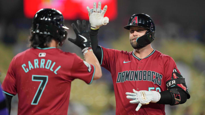 Jul 3, 2024; Los Angeles, California, USA; Arizona Diamondbacks first baseman Christian Walker (53) celebrates with center fielder Corbin Carroll (7) after hitting a three-run home run in the ninth inning against the Los Angeles Dodgers at Dodger Stadium. Mandatory Credit: Kirby Lee-USA TODAY Sports