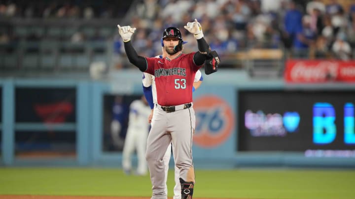 Jul 3, 2024; Los Angeles, California, USA; Arizona Diamondbacks first baseman Christian Walker (53) gestures after hitting a double in the sixth inning against the Los Angeles Dodgers at Dodger Stadium.