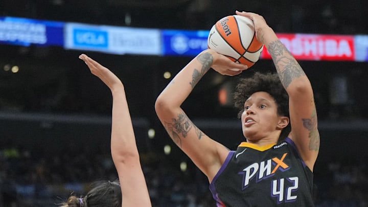 Jul 7, 2024; Los Angeles, California, USA; Phoenix Mercury center Brittney Griner (42) shoots the ball against LA Sparks center Li Yueru (28) in the first half at Crypto.com Arena. Mandatory Credit: Kirby Lee-Imagn Images