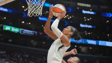 Jul 5, 2024; Los Angeles, California, USA; Las Vegas Aces center A'ja Wilson (22) shoots the ball against LA Sparks forward Dearica Hamby (5) in the second half at Crypto.com Arena. Mandatory Credit: Kirby Lee-USA TODAY Sports