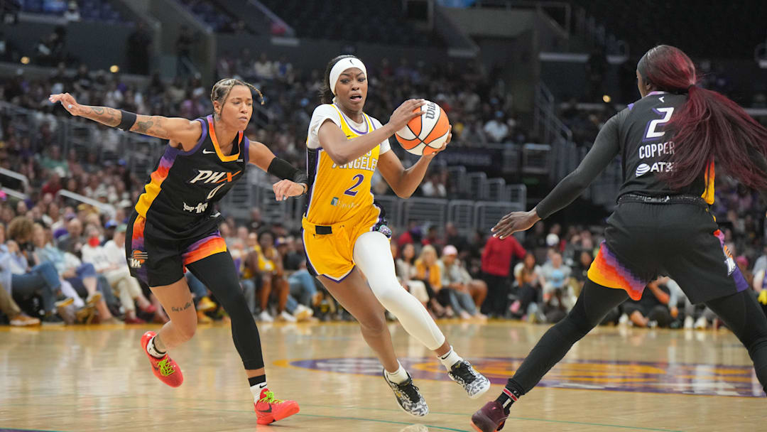 Jul 7, 2024; Los Angeles, California, USA; LA Sparks forward Rickea Jackson (2) dribbles against Phoenix Mercury guard Sug Sutton (1) and guard Kahleah Copper (2)  in the second half at Crypto.com Arena. Mandatory Credit: Kirby Lee-Imagn Images