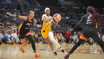 Jul 7, 2024; Los Angeles, California, USA; LA Sparks forward Rickea Jackson (2) dribbles against Phoenix Mercury guard Sug Sutton (1) and guard Kahleah Copper (2)  in the second half at Crypto.com Arena. Mandatory Credit: Kirby Lee-Imagn Images