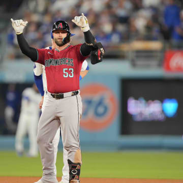 Jul 3, 2024; Los Angeles, California, USA; Arizona Diamondbacks first baseman Christian Walker (53) gestures after hitting a double in the sixth inning against the Los Angeles Dodgers at Dodger Stadium. Mandatory Credit: Kirby Lee-USA TODAY Sports
